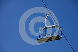 Lonely chairlift on blue sky