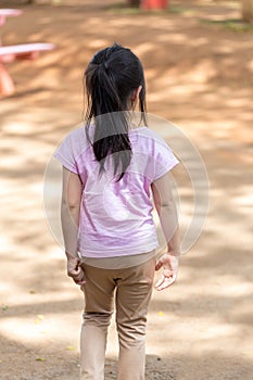 Lonely Child in Playground from Back View