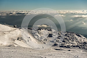 Lonely Cottage high in the Mountain in a snowy Winter Landscape