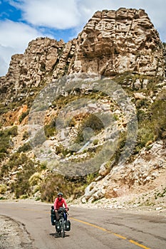 Lonely cyclist cycling on the Ruta 40 photo