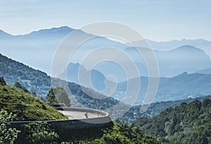 Lonely cyclist in the mountains