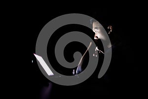 Lonely developer thinking solution with laptop at night in dark room