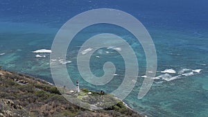 Lonely Diamond Head Lighthouse, and calm Pacific Ocean seen from the top of Diamond Head cone, Honolulu, Oahu Island, Hawaii, USA