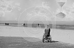 Lonely disabled young woman on beach. Sunny summer day