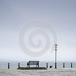 Lonely empty bench seat coastal sea peaceful quiet mindfulness scene view