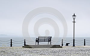 Lonely empty bench seat coastal sea peaceful quiet mindfulness scene view