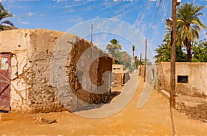Lonely empty unpaved road in a village in the desert of Sudan, A
