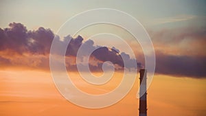 Lonely factory pipe polluting air against sunset, environmental problems, smoke from chimneys