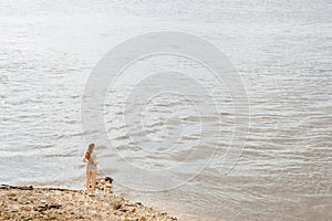 The lonely figure of a young woman at the end of the earth.