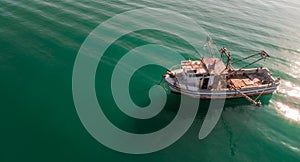 Lonely Fisher Boat in the Middle of a Peaceful Ocean