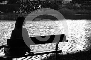 Lonely girl by the lake photo