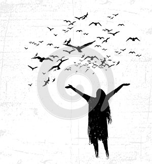 Lonely girl opening hands toward the birds.