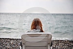 Lonely girl at the sea photo