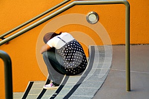 Lonely girl on stairs