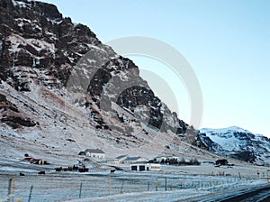 A lonely house at the foot of the mountains in Iceland. Incredible landscapes of nature. Life for a social phobia