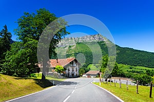 Lonely house near a road near Txarlazo mountain photo