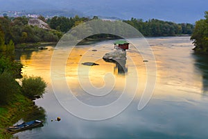 Lonely house on the river Drina in Bajina Basta, Serbia photo