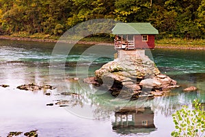 Lonely house on the river Drina in Bajina Basta, Serbia photo