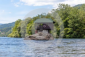 Lonely house on the river Drina near the Bajina Basta in Serbia photo