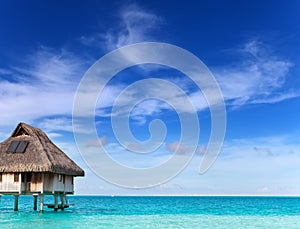 Lonely hut over the blue ocean