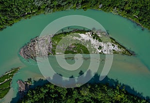 A lonely island in the Isar river in vertical view from a drone