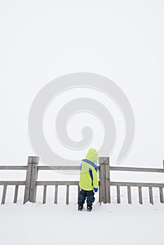 Lonely kid in snow