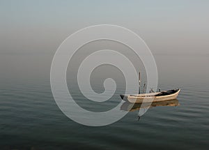 Lonely lagoon boat - calmness