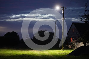 Lonely lantern in the village at night mystical and frightening