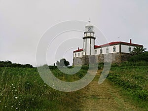 Lonely lighthouse in Ons island, Galicia photo