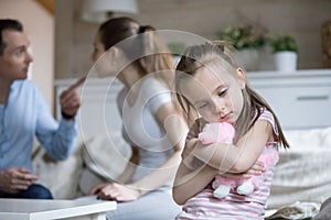 Lonely little girl feel sad because of parents fighting