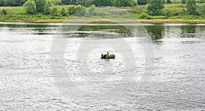 Lonely man in a motor boat on the Volga river