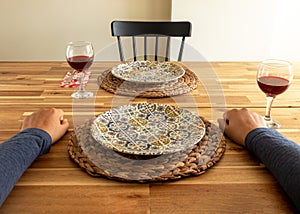 Lonely man sitting dinner table.