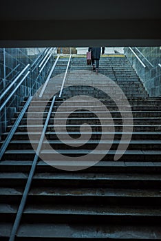 lonely man walking upstairs out
