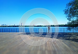 Lonely man watching river landscape background