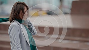 lonely middle aged woman is walking on city streets, bad mood, desperation and sadness