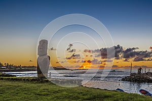Lonely moai at sunset near the marina of Hanga Roa photo