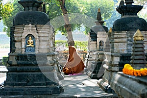 Lonely monk pray to Buddha in the park