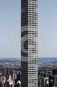 Lonely narrow and high skyscraper in New York City center - Vertical photo