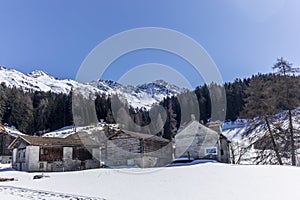 A lonely old farm on the empty and deserted ski slopes during the corona virus lockdown in the Swiss Alps