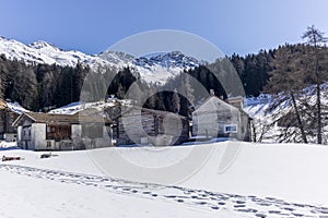 A lonely old farm on the empty and deserted ski slopes during the corona virus lockdown in the Swiss Alps