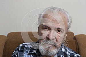 Lonely old man with sore eyes