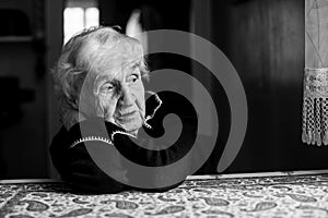 Lonely  old woman. Black and white photo
