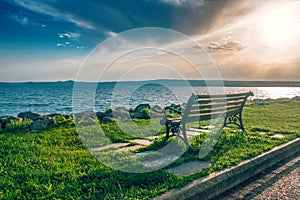 Lonely bench on sea coast