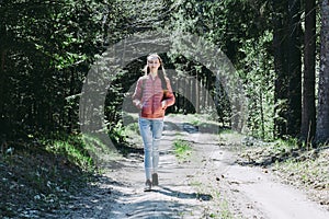 Lonely one girl walk in the road forest summer spring background, Relax time on holiday concept travel