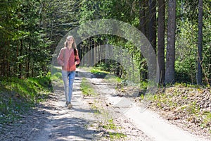 Lonely one girl walk in the road forest summer spring background, Relax time on holiday concept travel