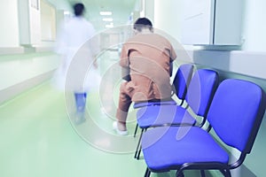 Lonely patient in hospital corridor