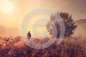 Lonely person in the morning mist. photo