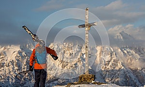 Lonely person portrait and Mountain Birnhorn Saalbach sunset summit cross