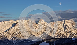 Lonely person portrait and Mountain Birnhorn Saalbach sunset summit cross