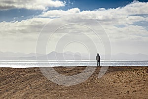 Lonely person at seashore